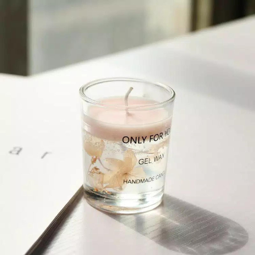 A delicate handmade gel wax candle in a clear glass, labeled "Only For You," resting softly in natural light.