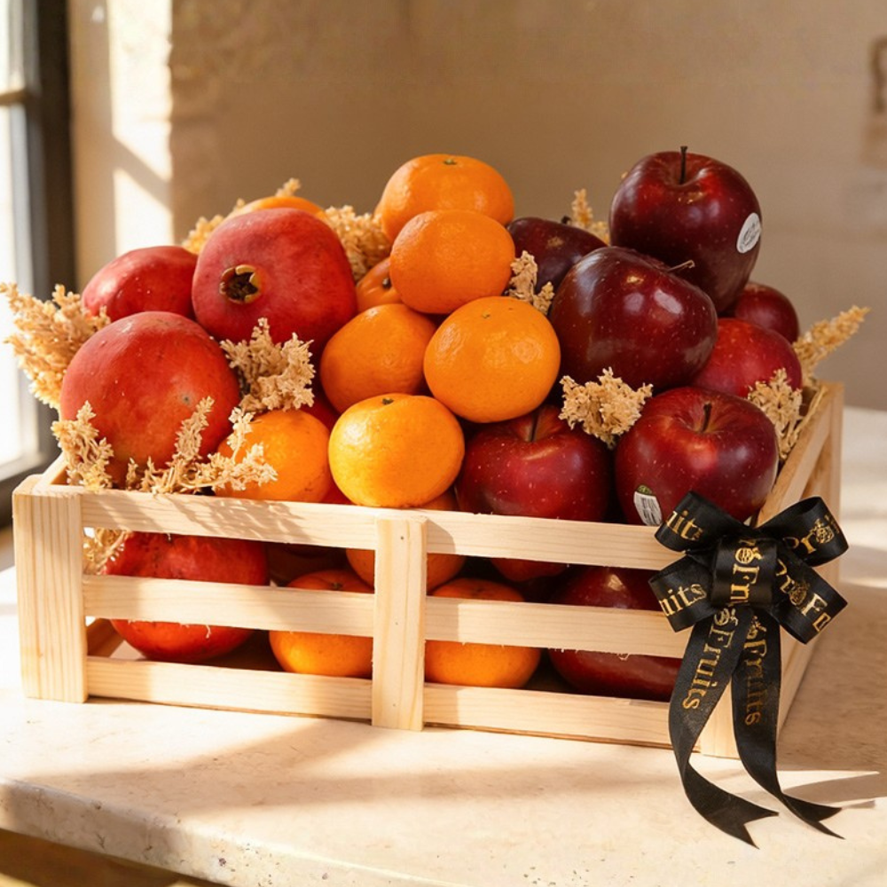 Ganesh Chaturthi fruit hamper with fresh apples, oranges and pomegranates